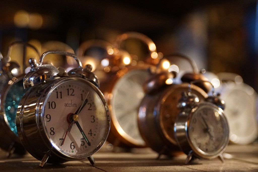 A photograph of alarm clocks. Procrastination can make time disappear!